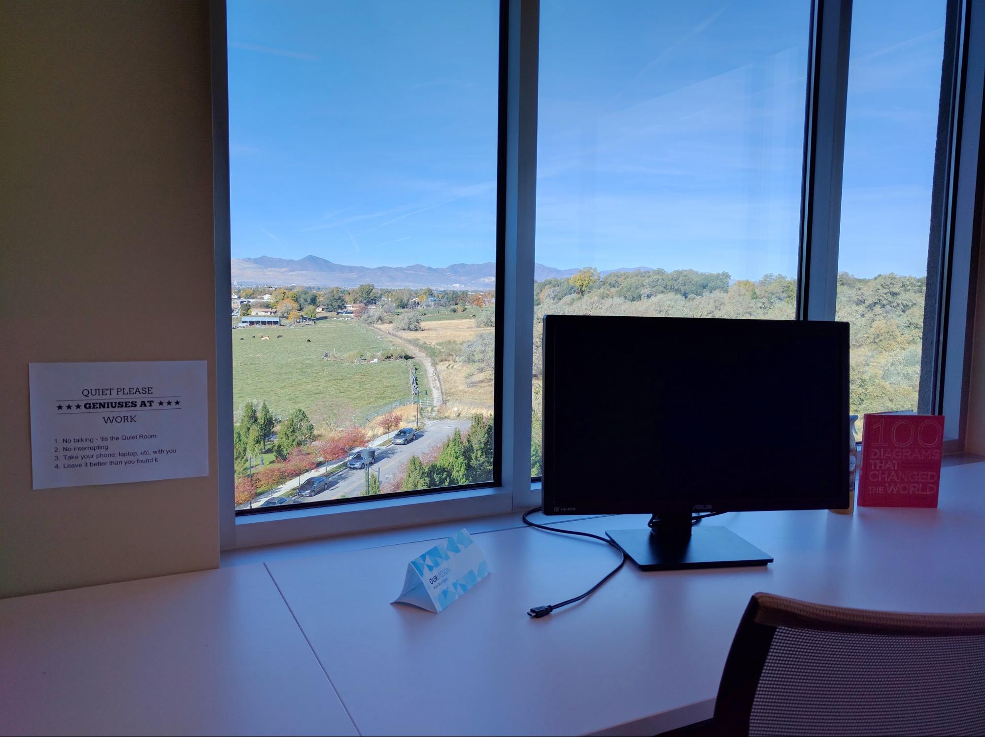 Inside the Quiet Room at Lucid Software Inc. A workplace with an external monitor and a beautiful view from the window.